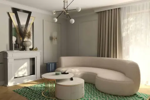 Eleganckie mieszkanie w stylu art deco z kremową sofą, kominkiem i geometryczną zieloną dywanem.